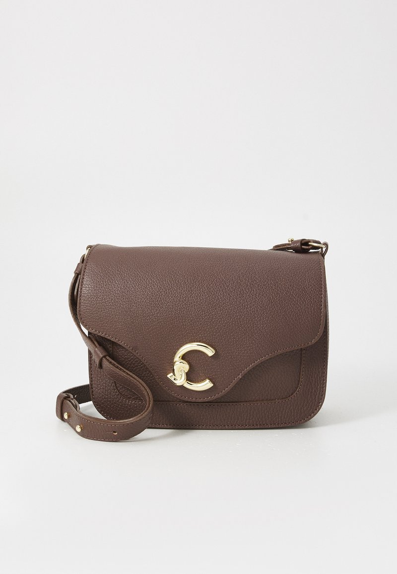 Brown leather shoulder bag with a textured finish, gold accent clasp, and adjustable strap. Features a flap closure and curved edges.