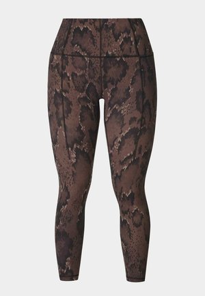 Leggings met hoge taille met een bruin-zwart slangenhuidpatroon en zichtbare stiksels aan de voorkant en zijkanten.