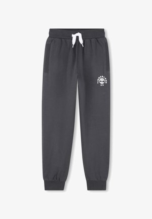 Pantalon de jogging gris foncé avec poignets élastiques, cordon de serrage blanc, poches latérales, et logo Timberland blanc sur la cuisse gauche.
