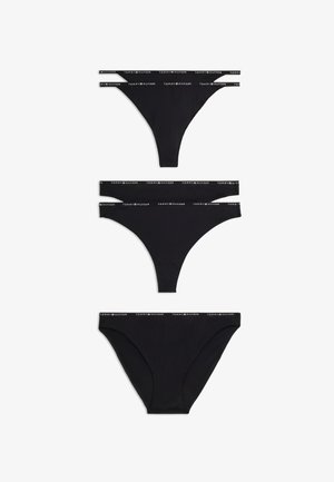 Trois styles de sous-vêtements noirs pour femmes Tommy Hilfiger avec des bandes élastiques de marque sur fond blanc.