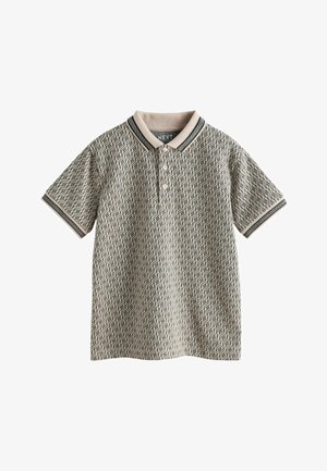 Beige polo-shirt med sort geometrisk mønster, korte ærmer, knaplukning og kontrastfarvet krave og ærmekanter.