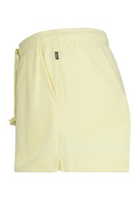 Yellow cotton shorts with an elastic waistband, drawstring detail, side pockets, and stitched hem, featuring a small brand label.