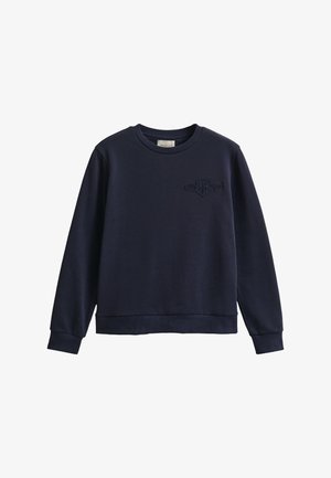 Marineblå langermet genser med rund hals, ribbestrikkede mansjetter og kant, med brodert logo på venstre bryst.