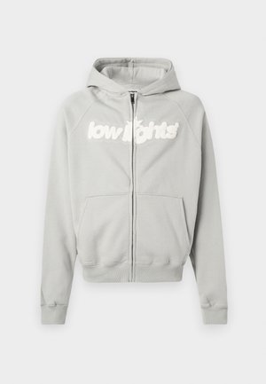 Gray zip-up hoodie made of soft cotton blend, featuring a lined hood, front pockets, and "low lights" logo in white across the chest.