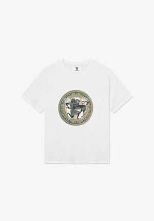 White cotton t-shirt with a round olive and gold printed design featuring a galloping black figure and abstract shapes in earthy tones.