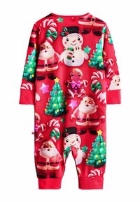 Rød langærmet jumpsuit med festlige motiver af julemanden, en snemænd, ingefærmand, juletræer, slikstokke og stjerner.