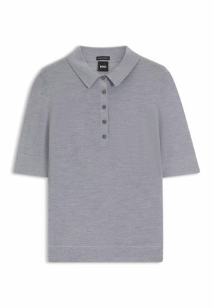 Polo shirt grigio a maniche corte realizzato in un tessuto morbido. Caratterizzato da un colletto e una fila di sei bottoni coordinati.
