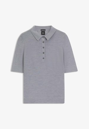 Polo shirt grigio a maniche corte realizzato in un tessuto morbido. Caratterizzato da un colletto e una fila di sei bottoni coordinati.