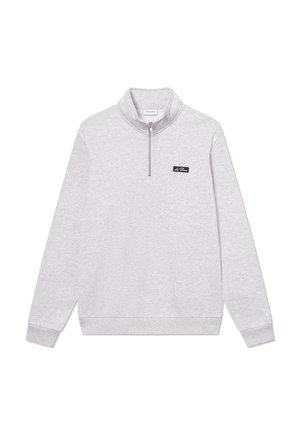 Light gray sweatshirt with a high collar and quarter zipper. Features ribbed cuffs and hem, with a small black logo patch on the chest.