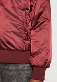 Tommy Hilfiger MINI REGULAR - Bomber stiliaus striukė - deep rouge