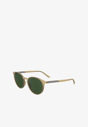 Óculos de sol redondos com uma armação transparente em bege claro e lentes verdes. Apresenta um fino detalhe em prata nas hastes. Design leve.