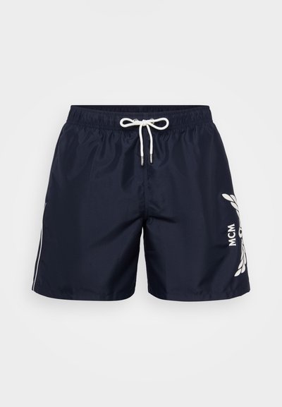 Navy swim shorts made of lightweight material with an elastic waistband, white drawstring, side stripes, and printed logo detail.