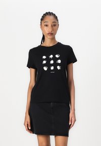 T-shirt en coton noir à manches courtes présentant un graphique blanc composé de neuf illustrations sur le thème marin disposées en motif de grille.