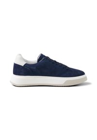 Navy blue suede sneaker with white heel tab, white thick rubber sole, and black laces, shown from the side on a white background.
