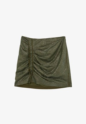 Olívazöld mini szoknya redőzött mintával, fémes szegecsekkel és sima szegéllyel. Díszítő oldalsó részletei gombokkal.