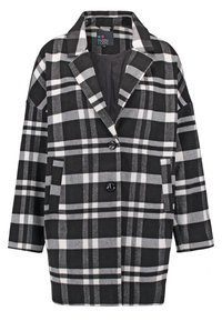 Manteau en laine à carreaux noir et blanc avec col à revers, deux boutons devant et poches latérales, longueur mi-cuisse, intérieur doublé.