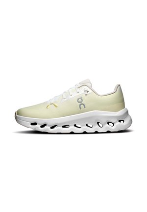 Chaussure de course basse beige clair avec semelle blanche comportant plusieurs découpes ovales et le logo de la marque "on" gris sur le côté.