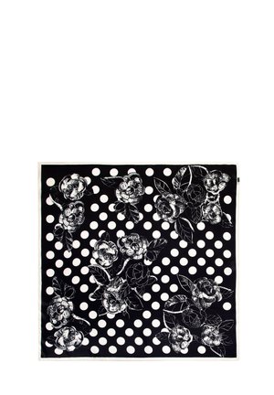 Écharpe noire avec un motif floral comprenant des roses blanches et des feuilles, superposé sur des pois blancs. Texture en soie avec une finition lisse.