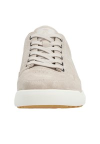Beige suede sneakers with white laces, a flat white rubber sole, and subtle perforations on the toe area. Simple design with no visible logos.