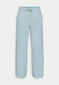 Lyseblå sweatpants laget av mykt stoff, med elastisk midjebånd med snøring, side lommer og rett ben design.