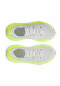 White athletic shoes with a mesh upper, bright yellow-green sole, and laces. Features logo on insole and smooth texture.