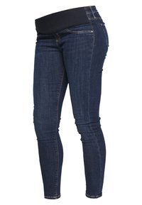 Pantalones vaqueros skinny de mezclilla azul oscuro con una cinturilla ancha y elástica negra, que cuentan con detalles de costura sutil y una silueta ajustada.
