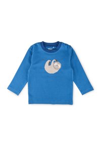Camicia a maniche lunghe per bambini di colore blu con una stampa di un bradipo sorridente appeso a un ramo sul davanti.