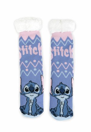 Calze blu con un morbido polsino bianco. Presentano un personaggio dei cartoni animati, un design a motivo con zig zag, testo che legge "Stitch" e accenti colorati.
