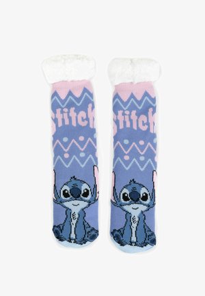 Blue socks with a plush white cuff. Features a cartoon character, patterned design with zigzags, text reading "Stitch," and colorful accents.