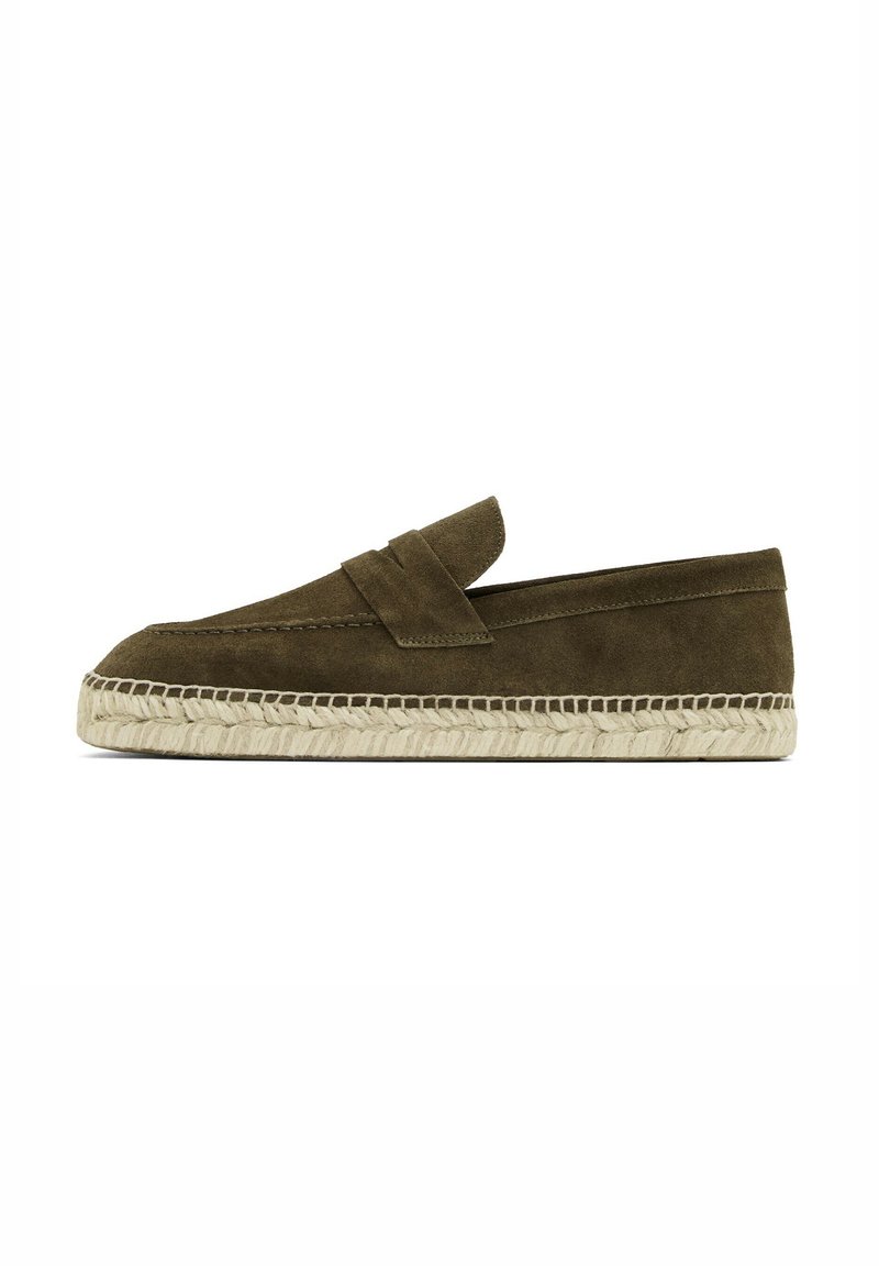 Olive suede espadrille with a flat design, woven jute midsole, and a narrow vamp strap across the instep. Soft texture and minimal detailing.
