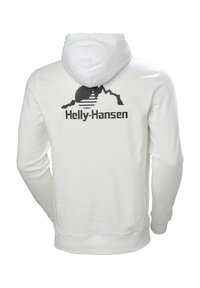 Sweat à capuche blanc avec un graphisme noir représentant un soleil et des montagnes dans le dos, avec le nom de la marque "Helly-Hansen" sous le dessin.