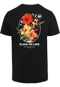 Black t-shirt featuring a vibrant floral design with red, orange, and yellow hibiscus flowers, hummingbirds, and the text "FLOW OF LIFE."