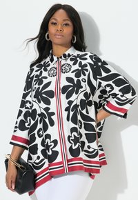 Blusa a fiori in bianco e nero con colletto, strisce rosse di accento e maniche a tre quarti, realizzata in un tessuto leggero e morbido.