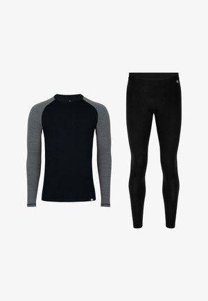 Termisk langærmet top med sort krop og grå raglanærmer, kombineret med sorte termoleggings. Begge har en glat tekstur og en tætsiddende pasform.