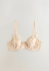 Bézs színű szatén és hálós balconnette melltartó állítható pántokkal és alátámasztó merevítővel, világos háttéren szétterítve.