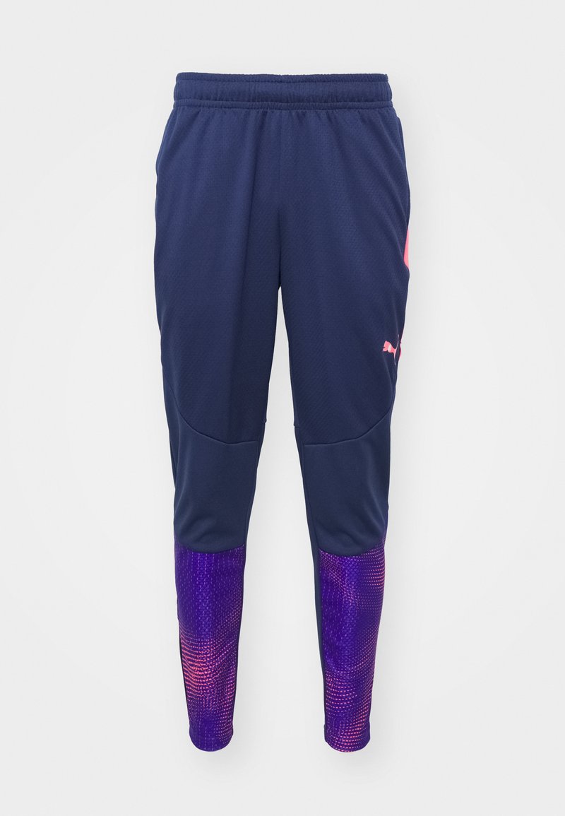 Pantalones deportivos de color marino con un diseño ajustado, detalles morados en las piernas inferiores con un patrón de degradado texturizado, y cintura elástica.