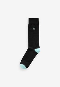 Black sock with a soft texture, featuring a light blue heel and toe. Includes a small blue logo on the upper part.
