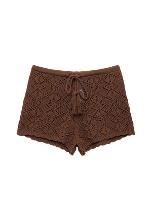 Brown crochet shorts with a geometric pattern, featuring a drawstring tie and scalloped edges. Made from a textured knit material.