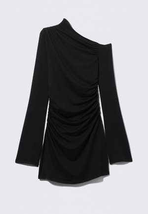 Black long-sleeve top with one-shoulder design, featuring gathered texture and smooth fabric, cuts at waist with flared sleeves.