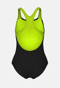 Uimaasu, jossa on kirkkaan limenvihreä yläosa ja musta alaosa. Sujuva ja joustava kangas, jossa on kontrastiväriset saumarivit.