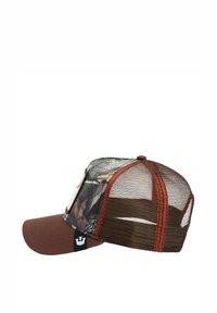 Brown baseball cap with mesh back. Front features camo pattern with earthy tones. Stitched accents in orange, logo tag on the side.