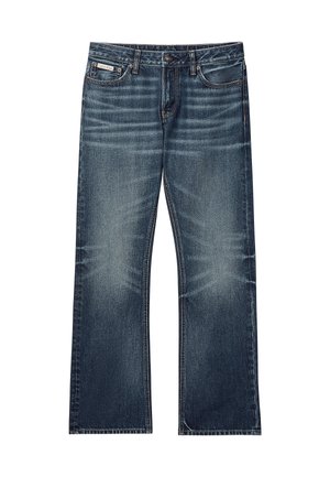 Donkerblauwe spijkerbroek met een losse pasvorm, wijde pijpen en subtiele vervaging. Voorzien van het standaard vijfzakkenontwerp en riemlussen.