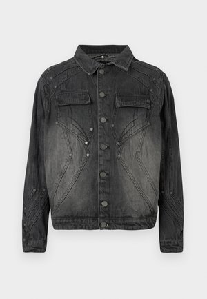 Must mustriks denim jakk musta värviga, millel on nööpide eesmine sulgemine, klapiga rinna-taskud ja dekoratiivsed õmblused.
