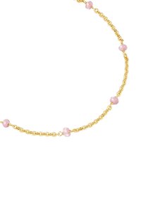 Kuldne kaelakee, millel on ebaühtlased roosad helmestad, mis on jaotatud kogu pikkuses. Helmestel on tekstureeritud pind ja need on läikivad.