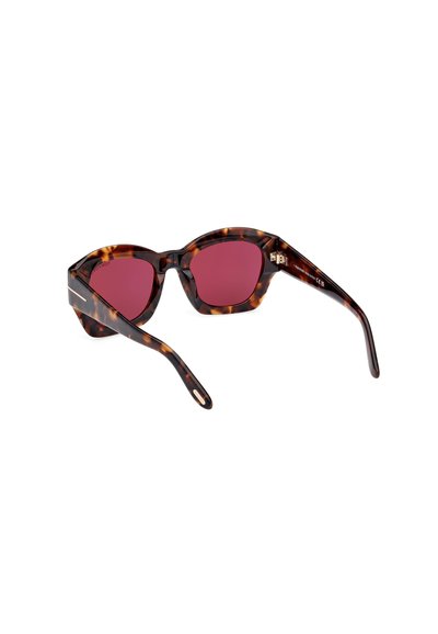 Lunettes de soleil en écaille de tortue avec des verres roses, design de monture géométrique et bras robustes. Présente un détail de marque sur la branche.