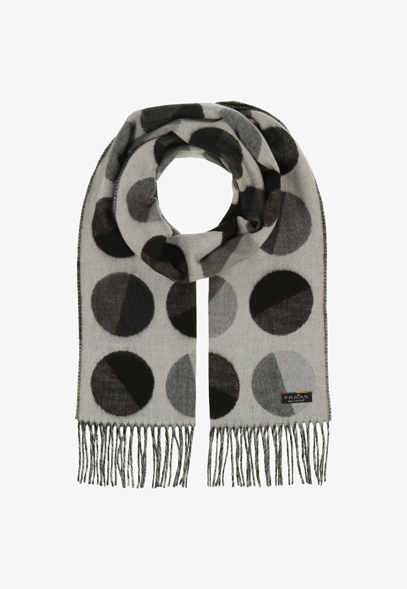 Hallidehall, millel on suured mustad ja hallid ringikujulised mustrid. Pehme tekstuur, äärised on fraktsioneeritud ja ühel otsal on väike brändi silt.