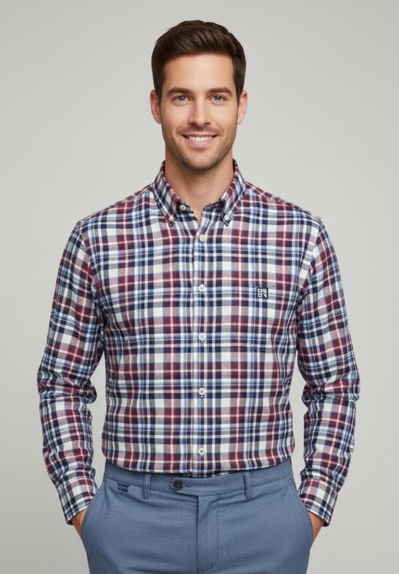 Camisa de cuadro en tonos rojo, marino y blanco, con un collar clásico y un bolsillo en el pecho, combinada con pantalones texturizados en azul claro.
