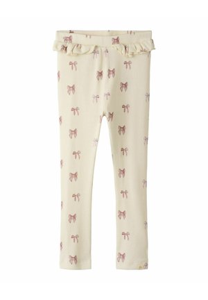 Cremefarbene, gerippte Leggings mit einem Muster aus kleinen rosa Schleifen und einem rüschengesäumten Bund. Weicher Stoff mit enganliegendem Schnitt.