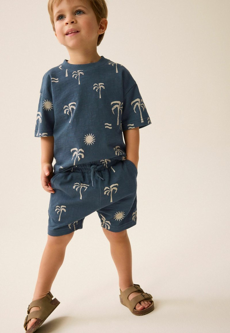 Next CHARACTER SET REGULAR FIT - Tracksuit bottoms - navy blue palms