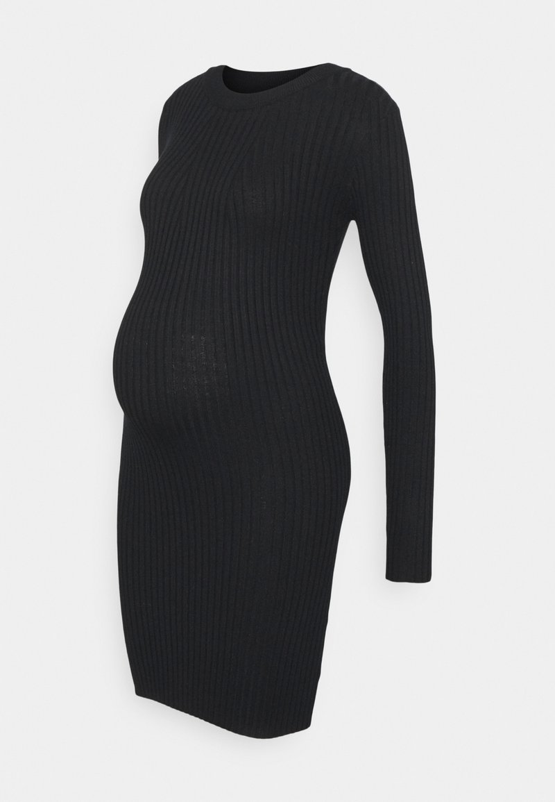 Robe de maternité noire en maille côtelée à manches longues, col rond et silhouette ajustée mettant en valeur le ventre arrondi.